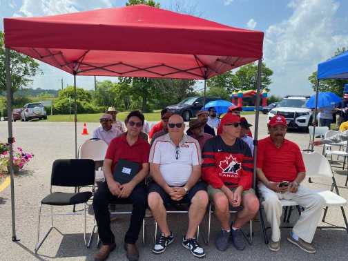 PaxUnity founder with Mayor Kevin Ashe and Councillor David Pickles at Canada Day 2026 in Pickering